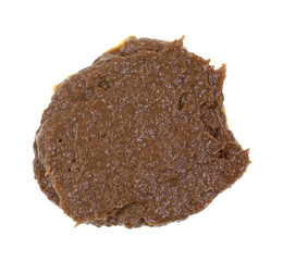 A portion of anchovy paste on a white background