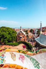 Fototapeta premium The Famous Summer Park Guell over bright blue sky in Barcelona