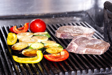 cooking a steak on the grill in the restaurant