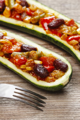 Zucchini stuffed with vegetable salad. Selective focus