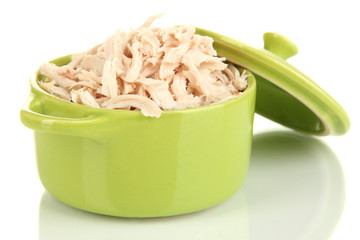 Shredded boiled chicken in green pan isolated on white