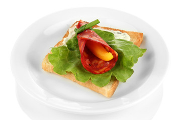 Salami rolls with paprika pieces inside,