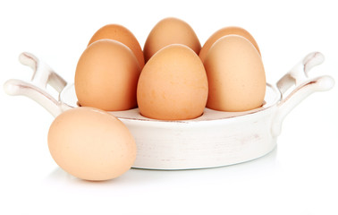 Eggs in plate for eggs isolated on white