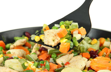Casserole with vegetables and meat on pan, isolated on white