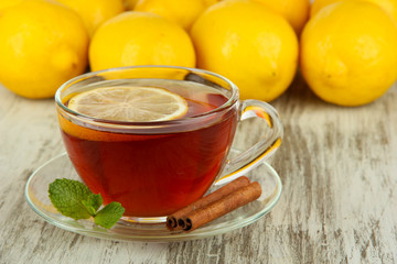 Cup of tea with lemon on table close-up