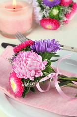Festive dining table setting with flowers