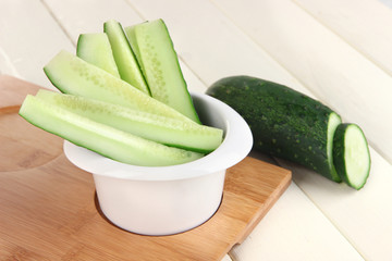 Bright fresh cucumber cut up slices in bowl