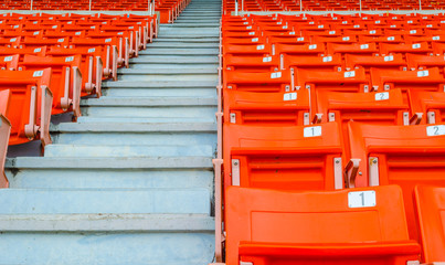 perspective view of orange seats in rows