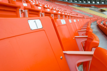 perspective view of orange seats in rows