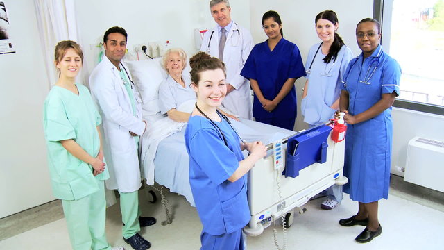 Portrait Multi Ethnic Hospital Medical Team With Patient