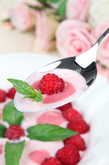 Sweet cream soup with fresh raspberry and sour cheese,