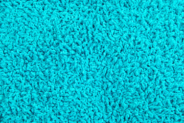 Fototapeta na wymiar Fleecy blue pillow close-up background