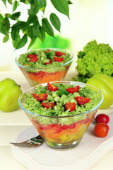 Tasty salad with fresh vegetables on wooden table