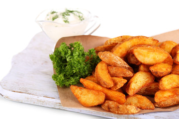Home potatoes on tracing paper on wooden board isolated on