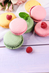 Gentle macaroons on table close-up