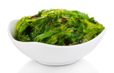 Sea kale in bowl close-up isolated on white