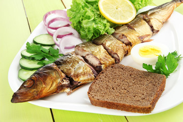 Smoked fish on plate close up