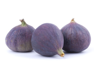 Three figs on a white background.