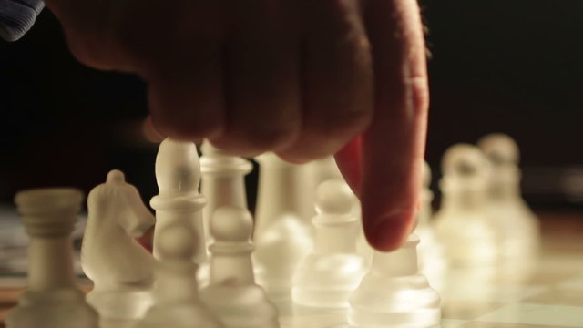 moving chess pieces on the chessboard: glass, finger, hand, move