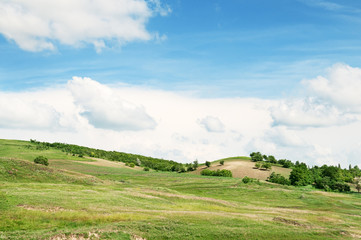 Fototapeta premium Mountainous terrain and the blue sky