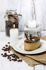 Cappuccino cake on white plate. Selective focus