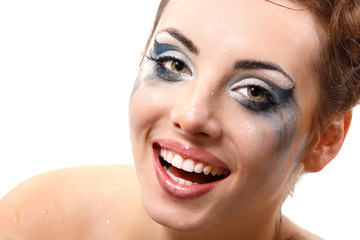 hysterics crying and smiling woman with wet makeup over white