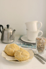 Breakfast with eclair on light background