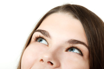 Obraz premium Beautiful happy teen girl looking up