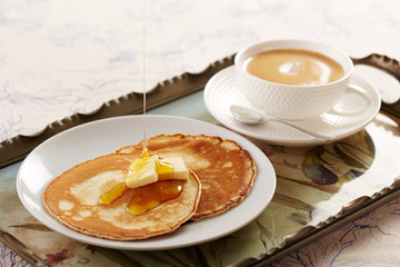 Pancakes with butter and caramel sauce
