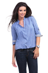 Fototapeta premium casual woman smiles with a thumb in pocket