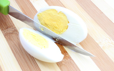 Sliced egg with knife