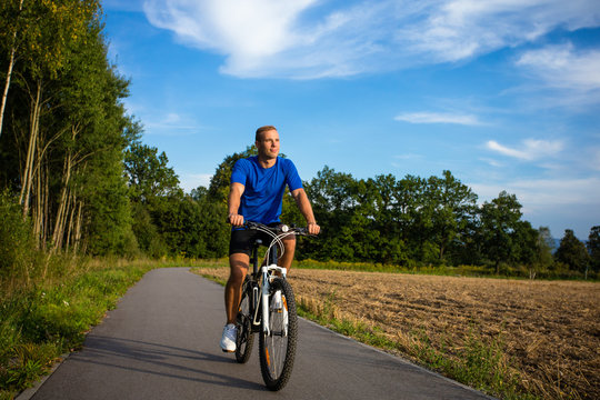 Healthy lifestyle - young man biking