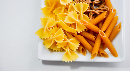 different organic pasta types in a bowl