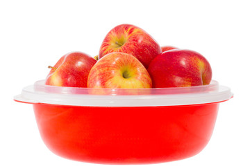 ripe red apples on a plate