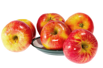 ripe red apples on a plate