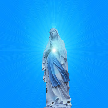 madonna  statue with blue sky background