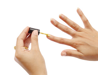 female hand with a golden nail polish on white background