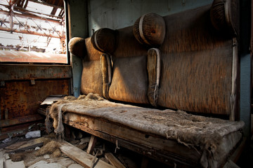Damaged retro seats in a cabin