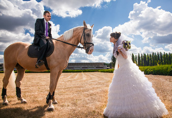Young groom on horseback going to his bride
