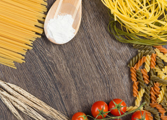 pasta, tomatoes and flour on the spoon