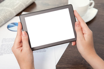 businesswoman hand holding a tablet against the background of th