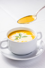 Pumpkin soup on served table