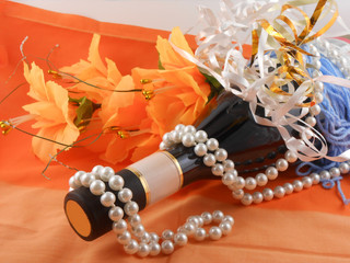 flowers, white diamonds and a champagne bottle