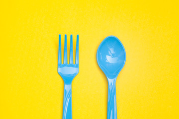 plastic spoon isolated on yellow background