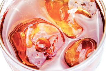 soft drink with ice in glass close up