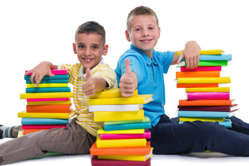 schoolboys showing thumbs up gesture