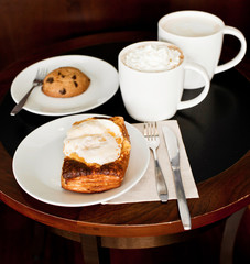 Savoury puff pastry with egg, served with cappuccino