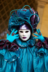 Venetian costume attends Carnival of Venice.