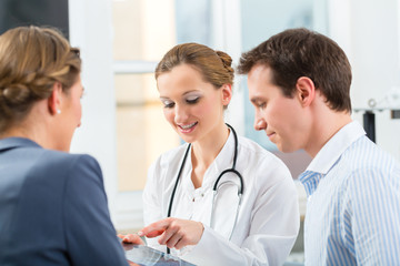 Doctor with patients in a consulting in clinic