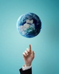 hand pointing at earth